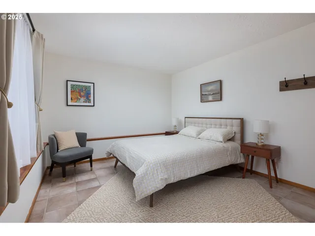 a bedroom with a bed and a couch