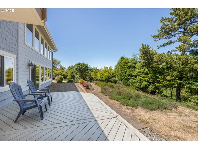 a wooden bench sitting in middle of a yard