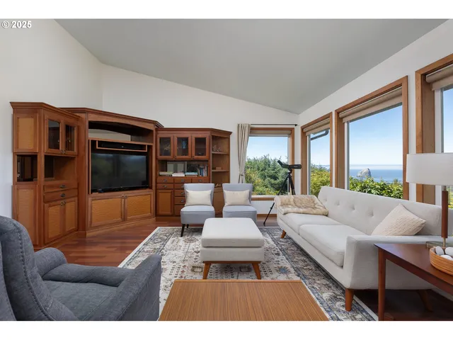 a living room with furniture fireplace and a flat screen tv