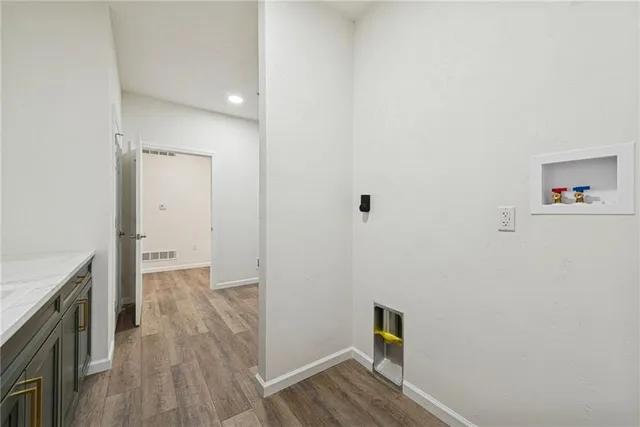 a bedroom with a bed and a flat screen television