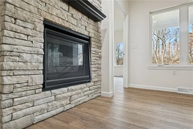 a view of fireplace with wooden floor