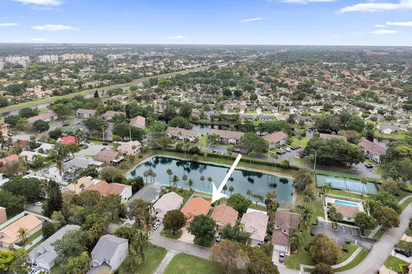 an aerial view of residential houses with outdoor space