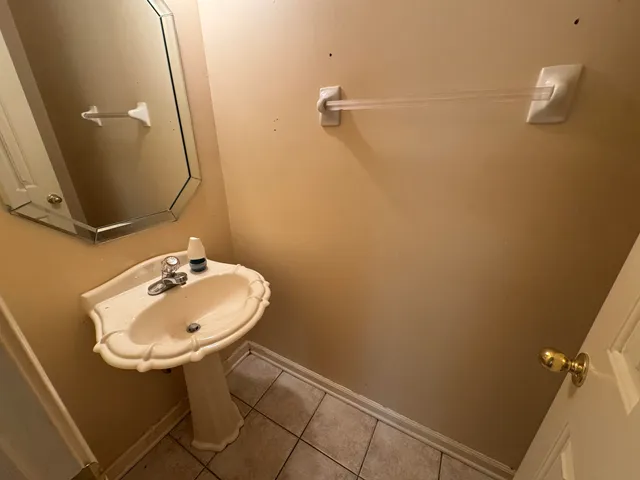a bathroom with a sink and mirror