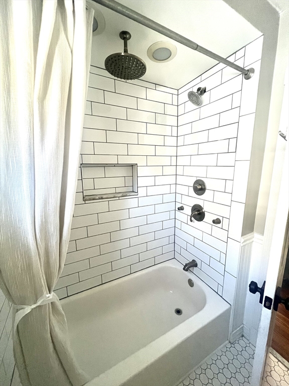 52 Victoria Street, Unit B Somerville, MA 02144 - Photo 5 of 15 a bathroom with a bathtub and shower
