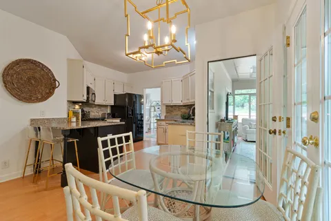 a living room with furniture and large windows