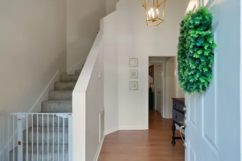a view of a hallway view of a kitchen