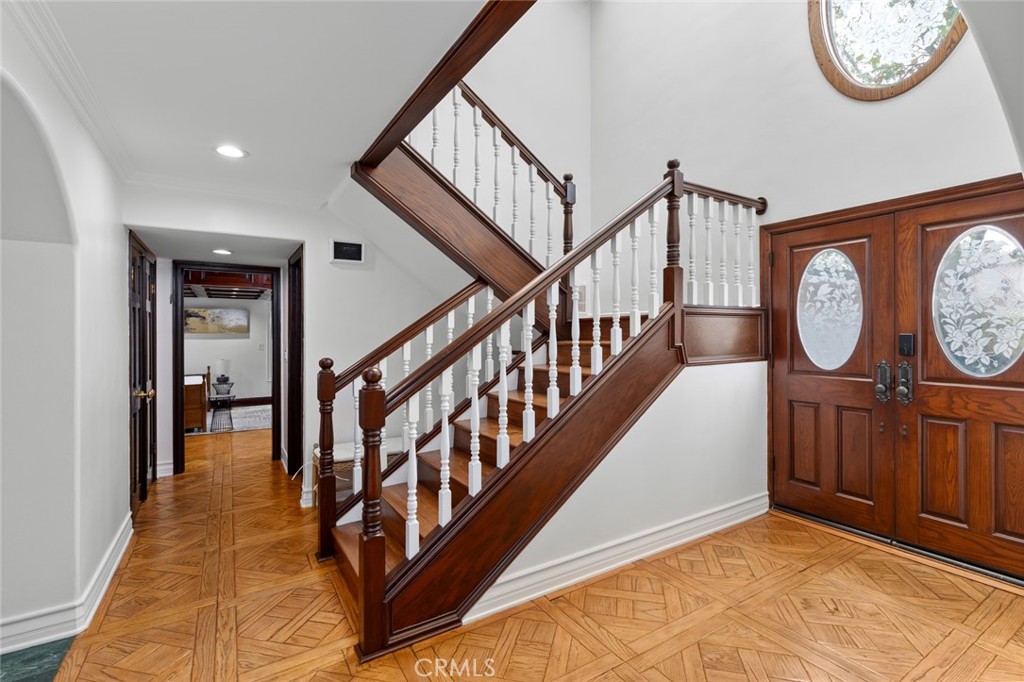 16842 Harkness Circle Huntington Beach, CA 92649 - Photo 16 of 43 a view of a hallway with wooden floor and entryway