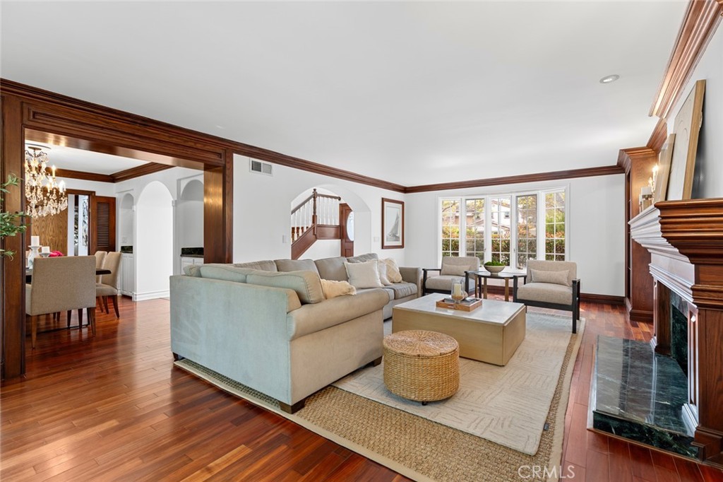 16842 Harkness Circle Huntington Beach, CA 92649 - Photo 19 of 43 a living room with fireplace furniture and a large window