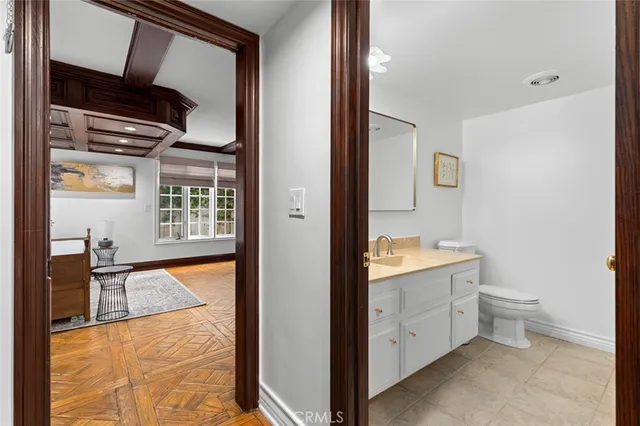 a bathroom with a granite countertop sink a mirror and a bathtub