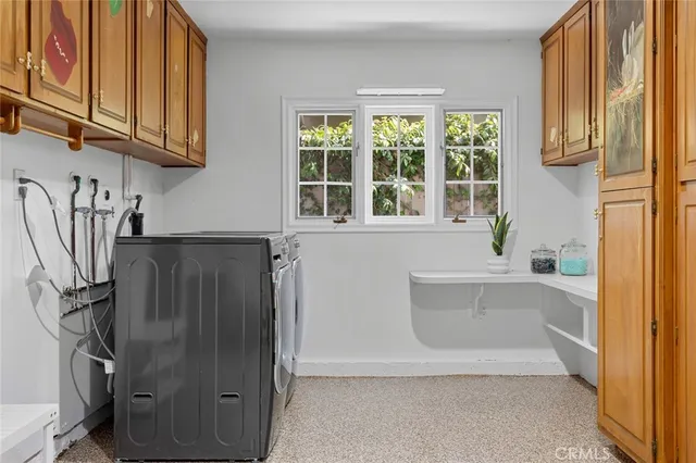 a bathroom with a tub a sink and a window