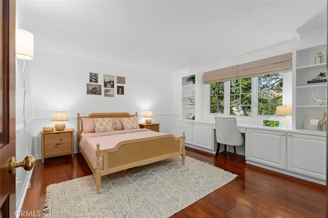 a bed room with a bed and a window