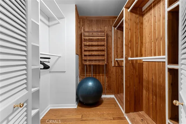 a bedroom with double bed and a window