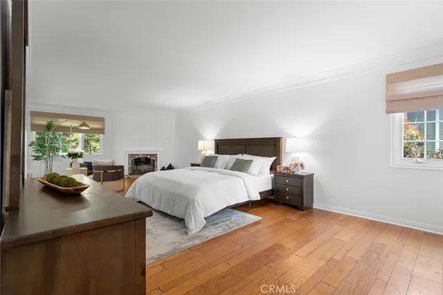 a spacious bedroom with a bed and a dresser in it