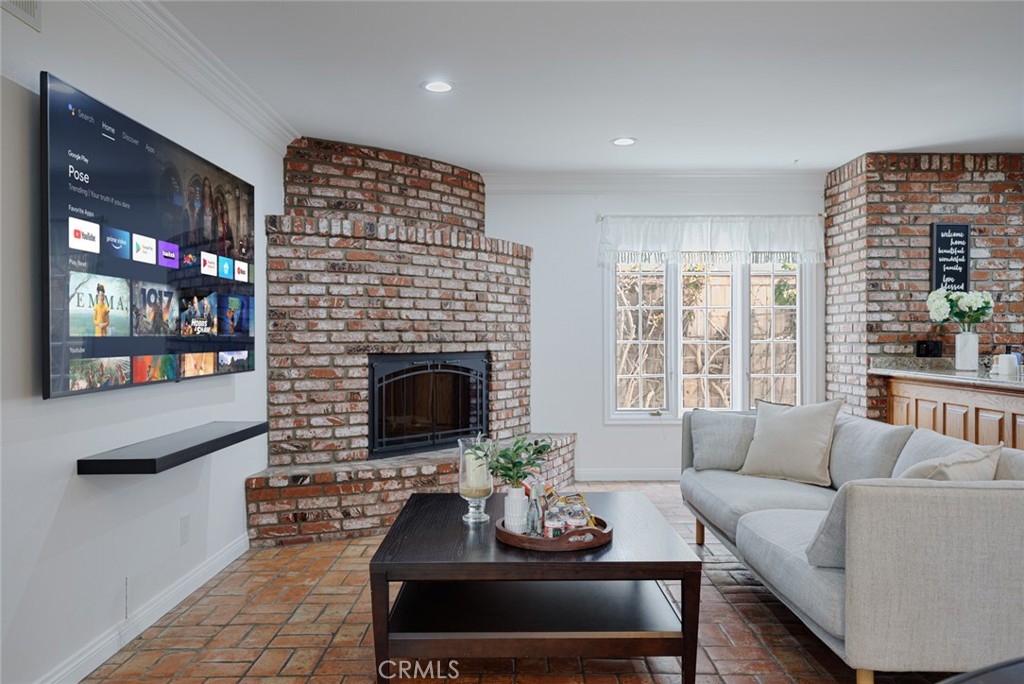 16842 Harkness Circle Huntington Beach, CA 92649 - Photo 10 of 43 a living room with furniture and a fireplace