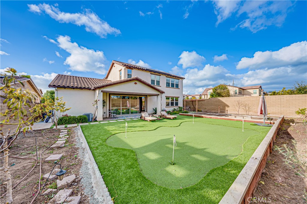 106 Tinker Irvine, CA 92618 - Photo 13 of 36 a front view of a house with swimming pool