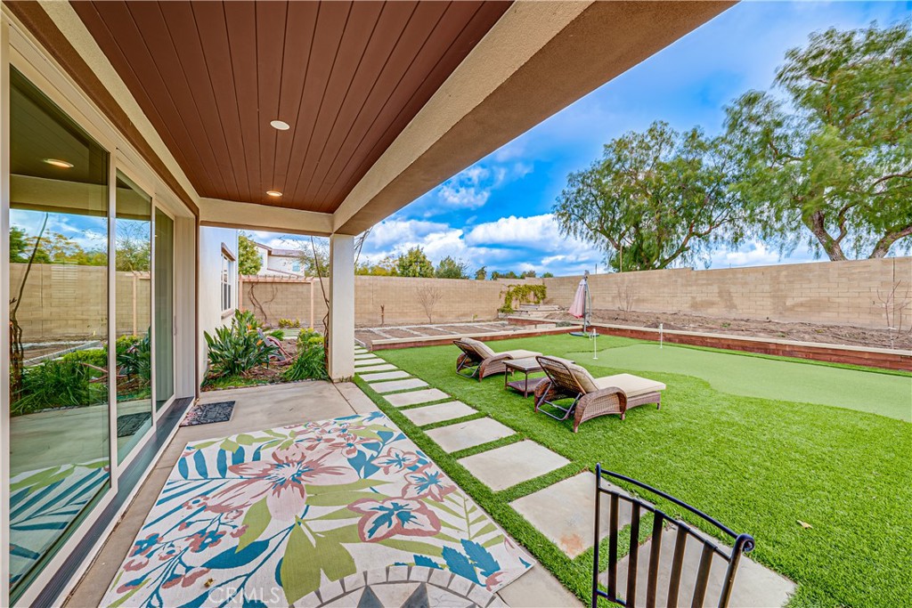 106 Tinker Irvine, CA 92618 - Photo 14 of 36 a view of an outdoor sitting area with a swimming pool