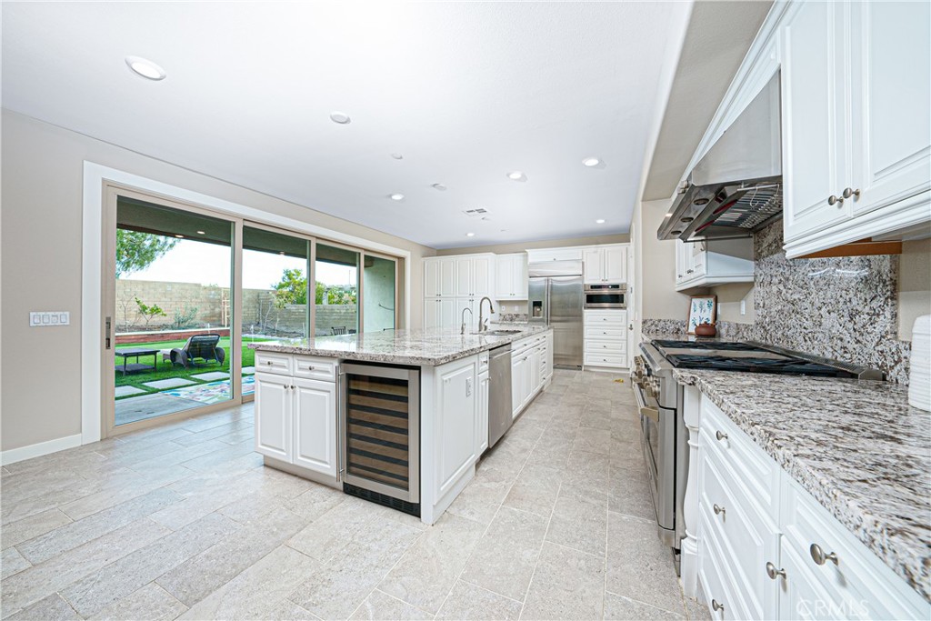 106 Tinker Irvine, CA 92618 - Photo 17 of 36 a kitchen with a stove a sink and a refrigerator