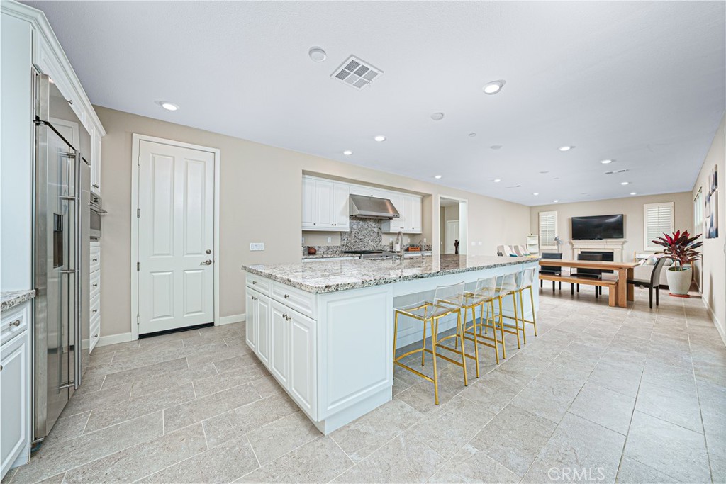 106 Tinker Irvine, CA 92618 - Photo 19 of 36 a kitchen with kitchen island granite countertop lots of counter top space