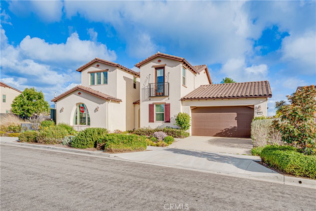 106 Tinker Irvine, CA 92618 - Photo 2 of 36 a front view of a house with a yard and garage