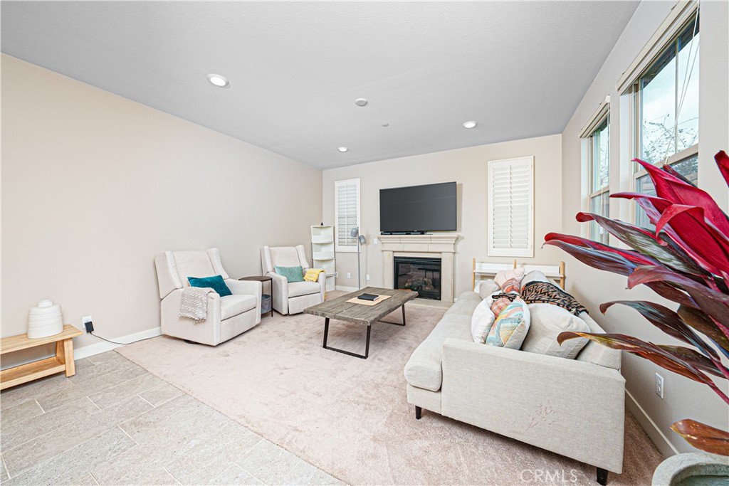 106 Tinker Irvine, CA 92618 - Photo 21 of 36 a living room with furniture fireplace and a flat screen tv
