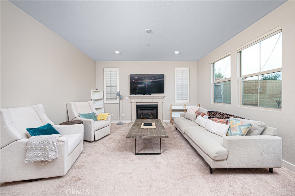 106 Tinker Irvine, CA 92618 - Photo 22 of 36 a living room with furniture fireplace and flat screen tv