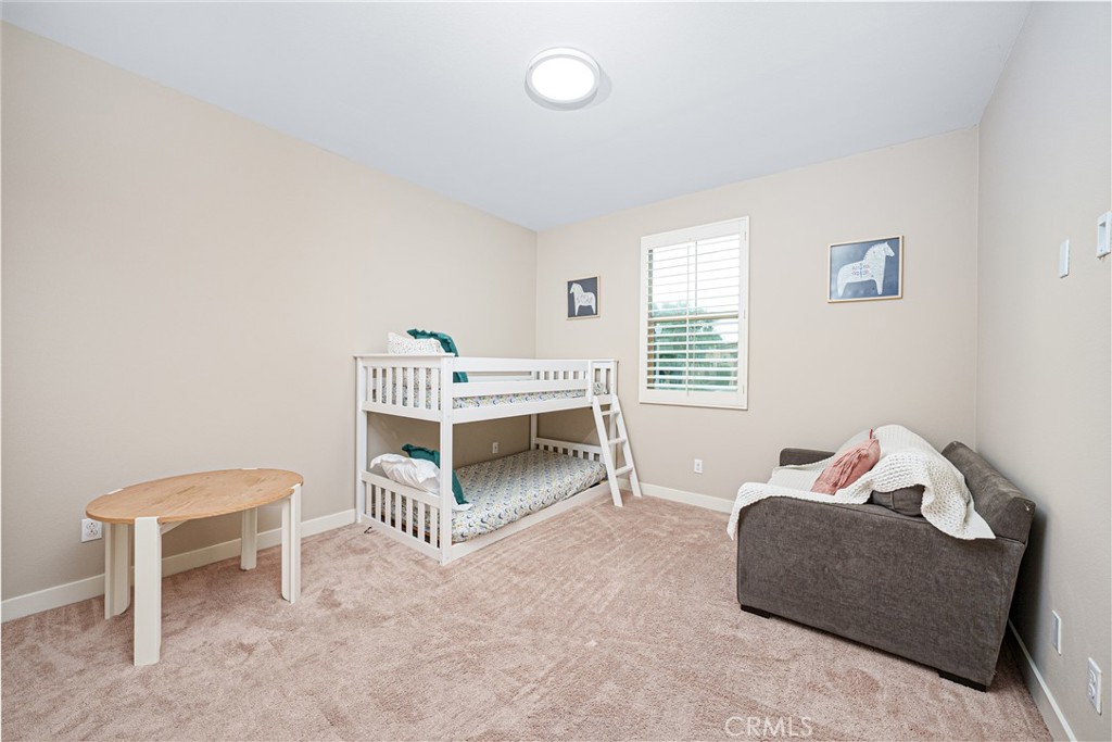 106 Tinker Irvine, CA 92618 - Photo 27 of 36 a bedroom with furniture and a window