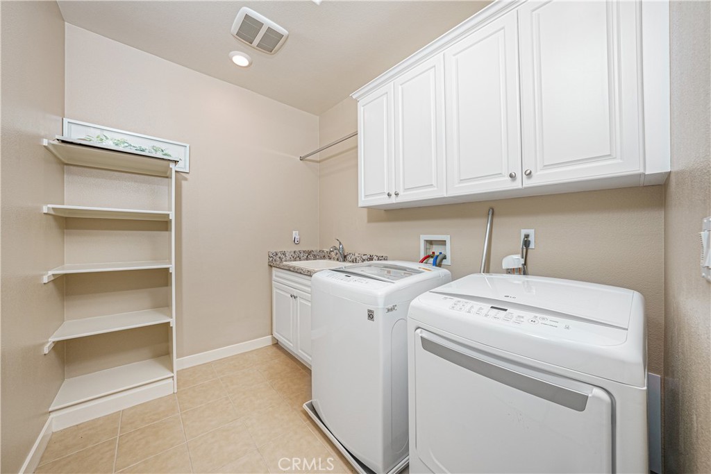 106 Tinker Irvine, CA 92618 - Photo 30 of 36 a utility room with dryer and washer