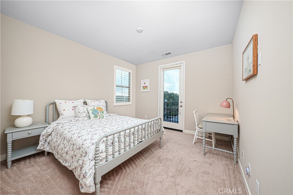 106 Tinker Irvine, CA 92618 - Photo 31 of 36 a bedroom with a bed and a chair