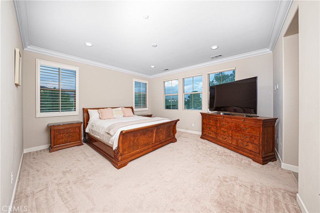 106 Tinker Irvine, CA 92618 - Photo 34 of 36 a bedroom with a bed and a flat screen tv