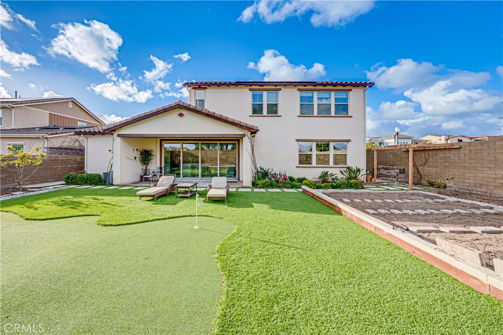106 Tinker Irvine, CA 92618 - Photo 8 of 36 a view of a house with a swimming pool