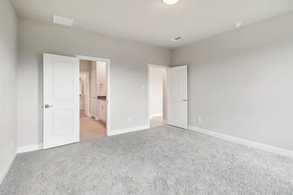a spacious bathroom with double sink and a mirror
