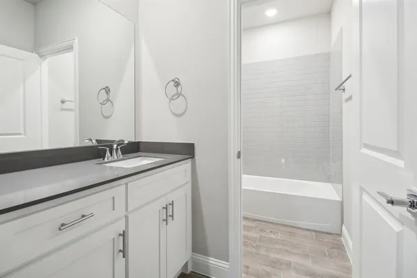 a bathroom with a toilet and bathtub