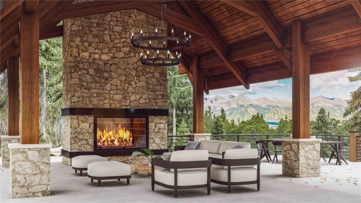 a outdoor living space with furniture and a fireplace
