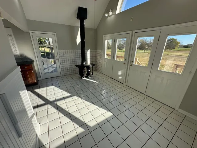 a view of an entryway with wooden floor