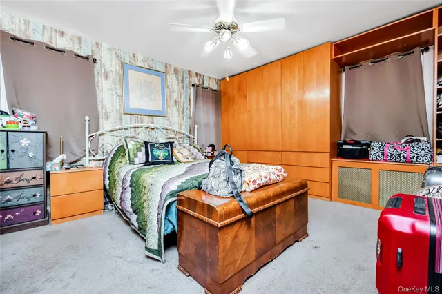 a bedroom with bed and window