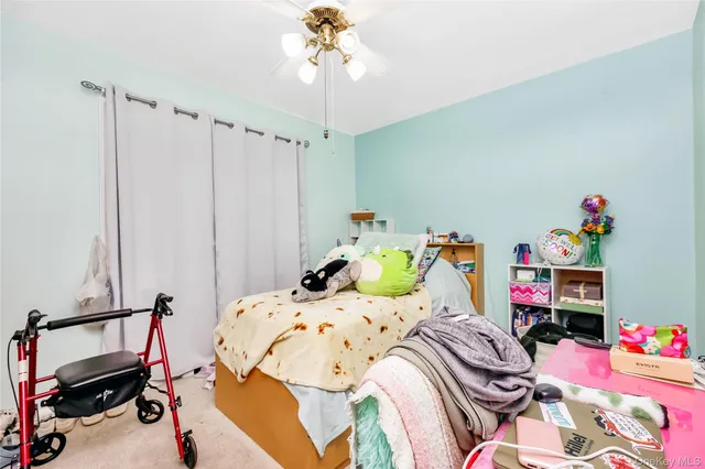 a bedroom with a bed and a table in it