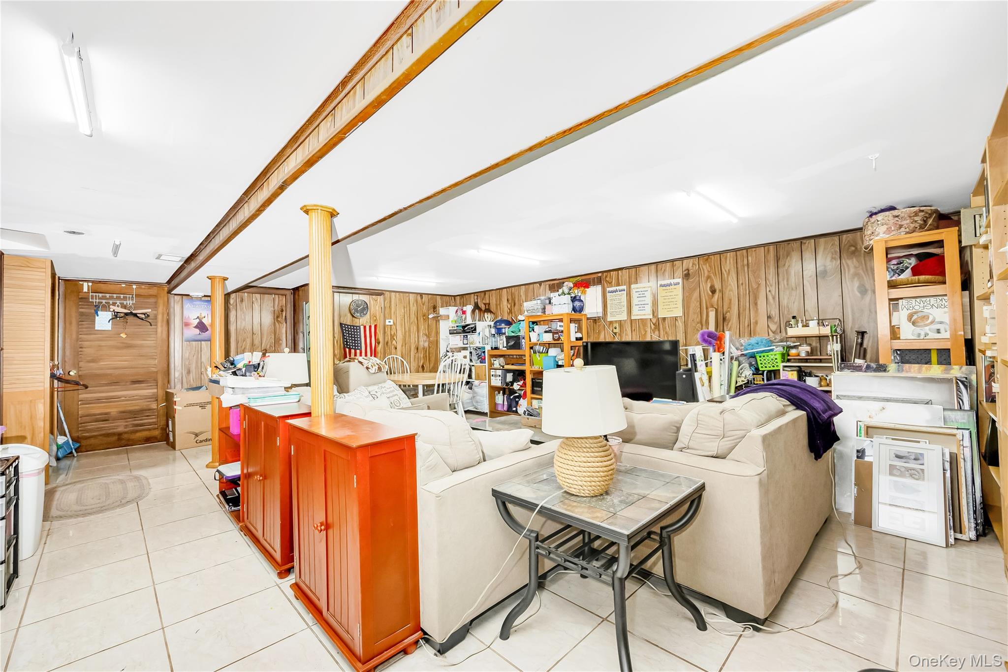 65-32 170th Street Queens, NY 11365 - Photo 17 of 24 a dining room with furniture and a floor to ceiling window