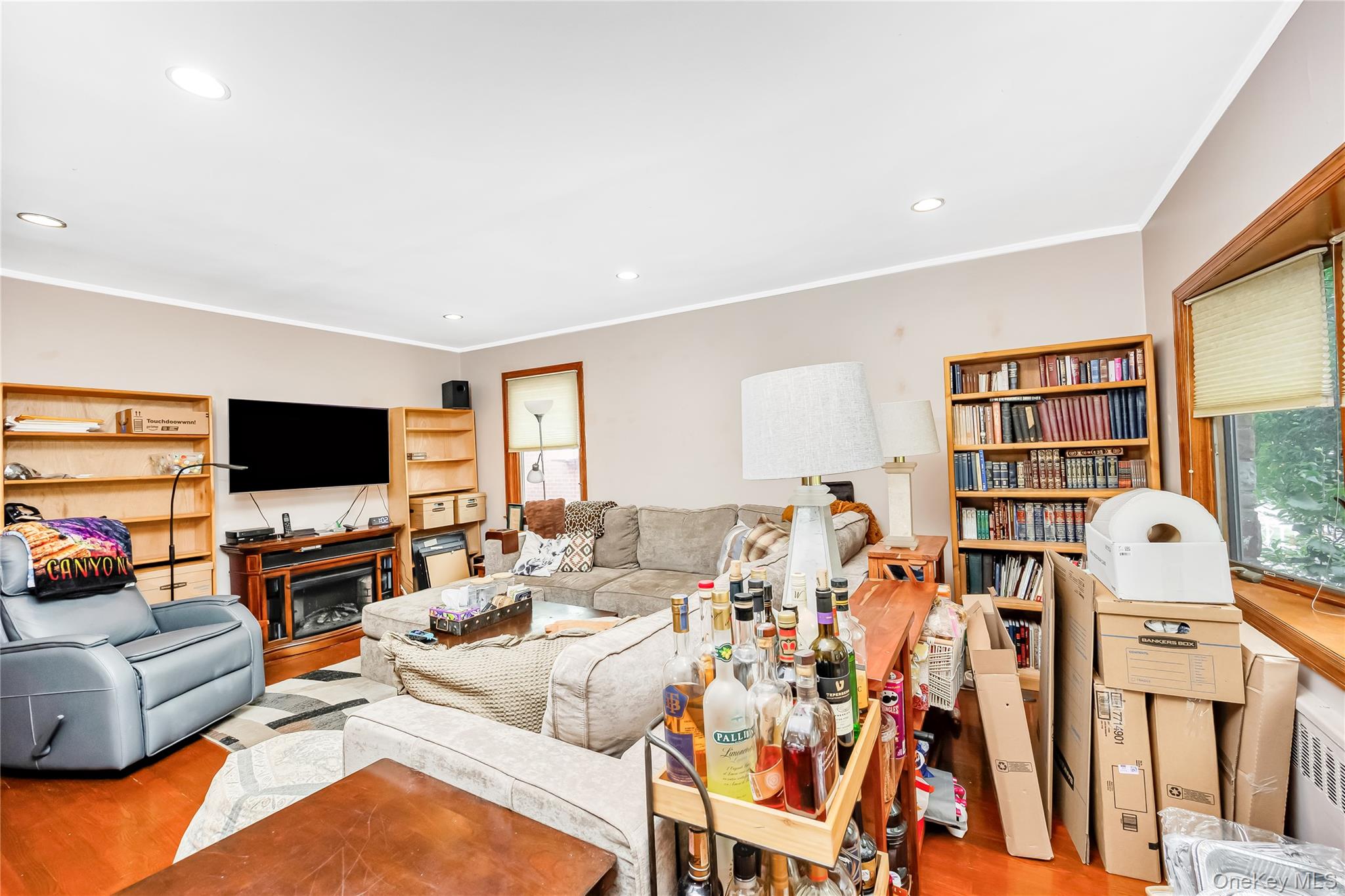 65-32 170th Street Queens, NY 11365 - Photo 8 of 24 a living room with furniture kitchen view and a flat screen tv