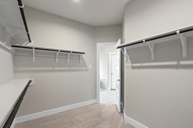 a white bath tub sitting next to a bathroom sink