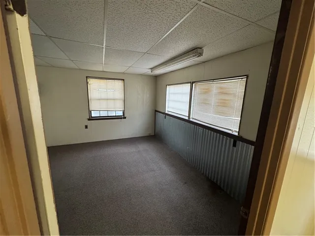 a view of empty room with windows
