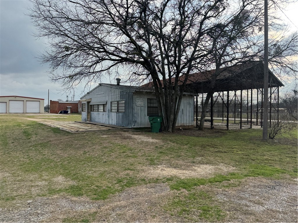 208 Spruce Abbott, TX 76621 - Photo 6 of 9 a house with trees in front of it