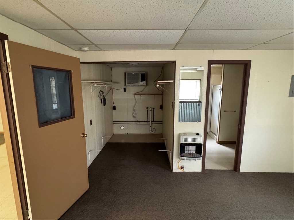 208 Spruce Abbott, TX 76621 - Photo 8 of 9 a view of hallway with washer and dryer