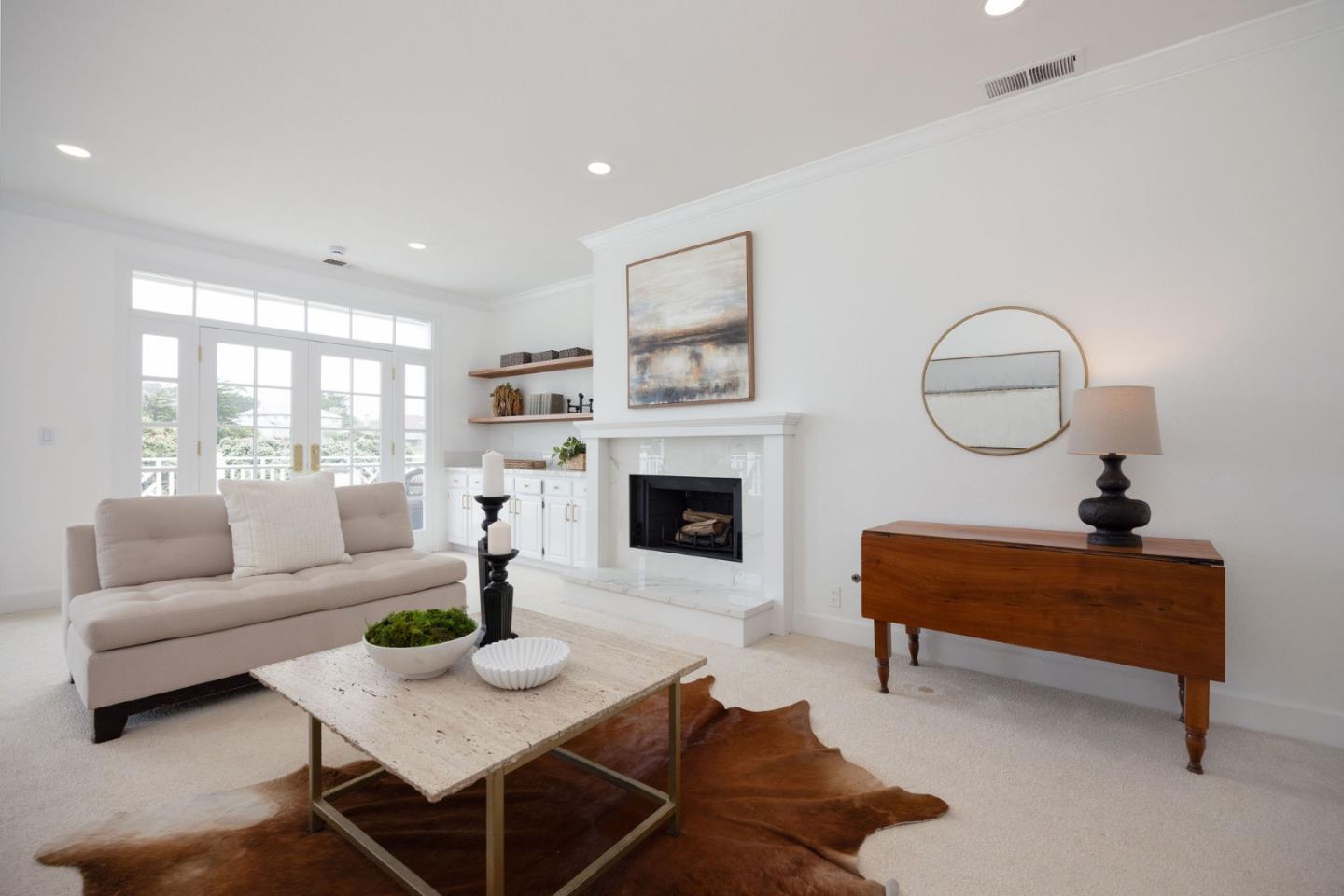 3 Ashdown Place Half Moon Bay, CA 94019 - Photo 6 of 31 a living room with furniture a fireplace and a table