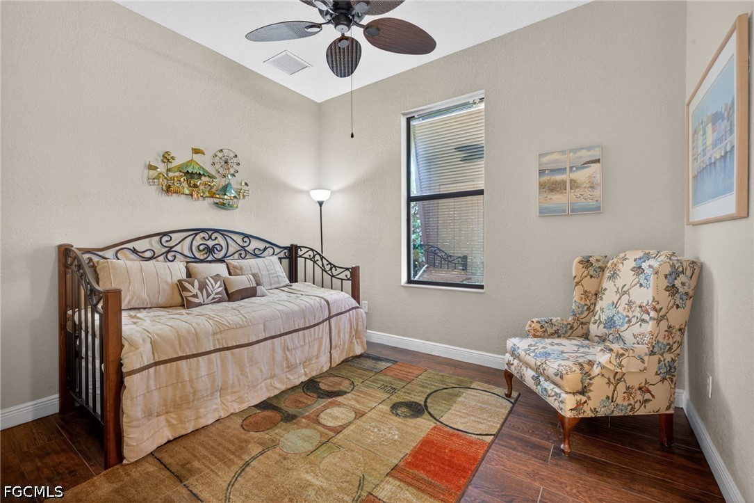 6109 Calusa Rdg Trail Bokeelia, FL 33922 - Photo 35 of 48 a bedroom with a bed couch and window