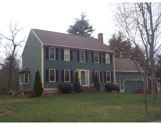 7 Fieldstone Drive Mansfield, MA 02048 - Photo 1 of 1 a front view of a house with garden and trees