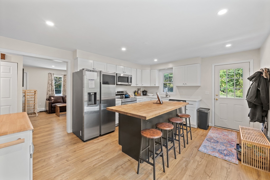 89 River Road Sturbridge, MA 01566 - Photo 5 of 31 a kitchen with refrigerator and window