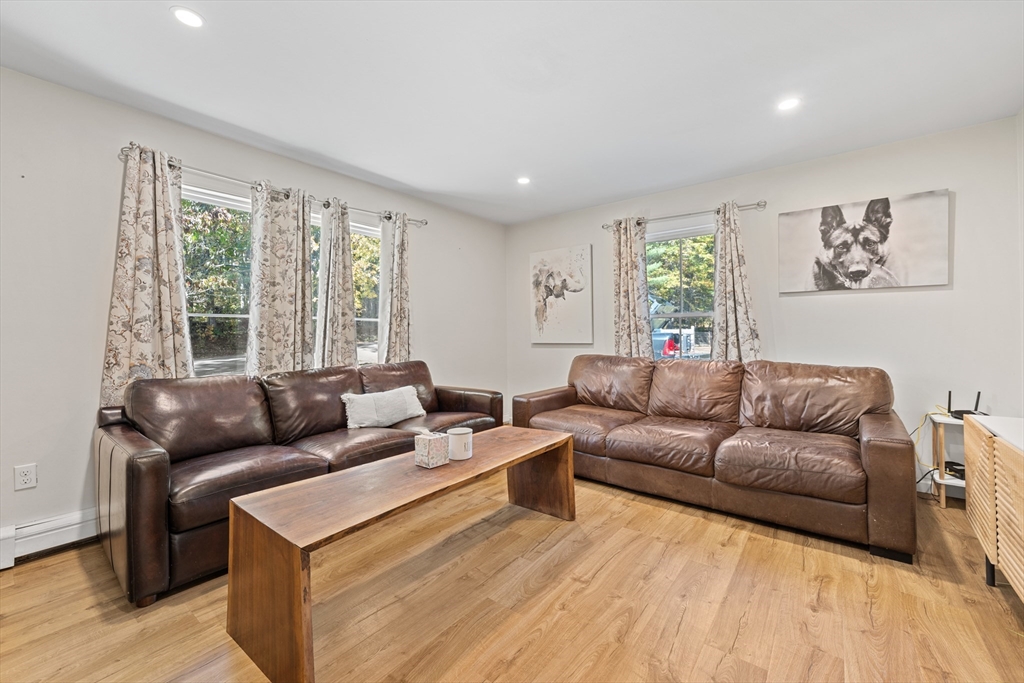 89 River Road Sturbridge, MA 01566 - Photo 7 of 31 a living room with furniture and a large window