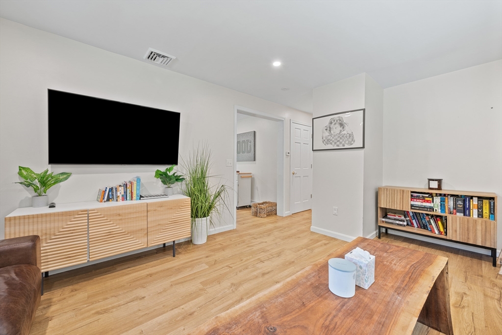 89 River Road Sturbridge, MA 01566 - Photo 8 of 31 a living room with furniture and a flat screen tv