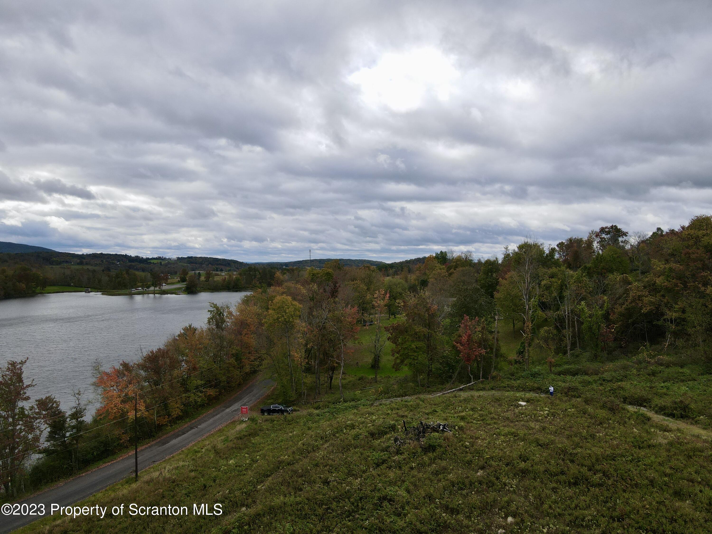 Fords Pond Road Dalton, PA 18414 - Photo 2 of 9 a view of a lake with a yard