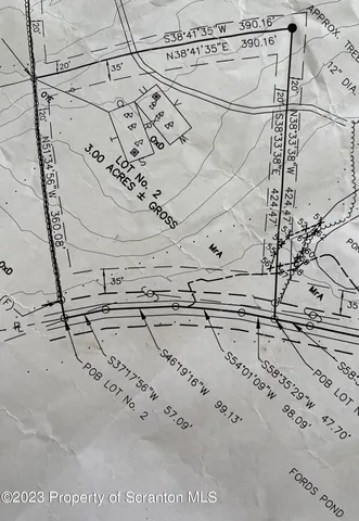 a view of a lake with a yard